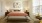 large bedroom with attached bath and large windows