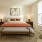 large bedroom with attached bath and large windows